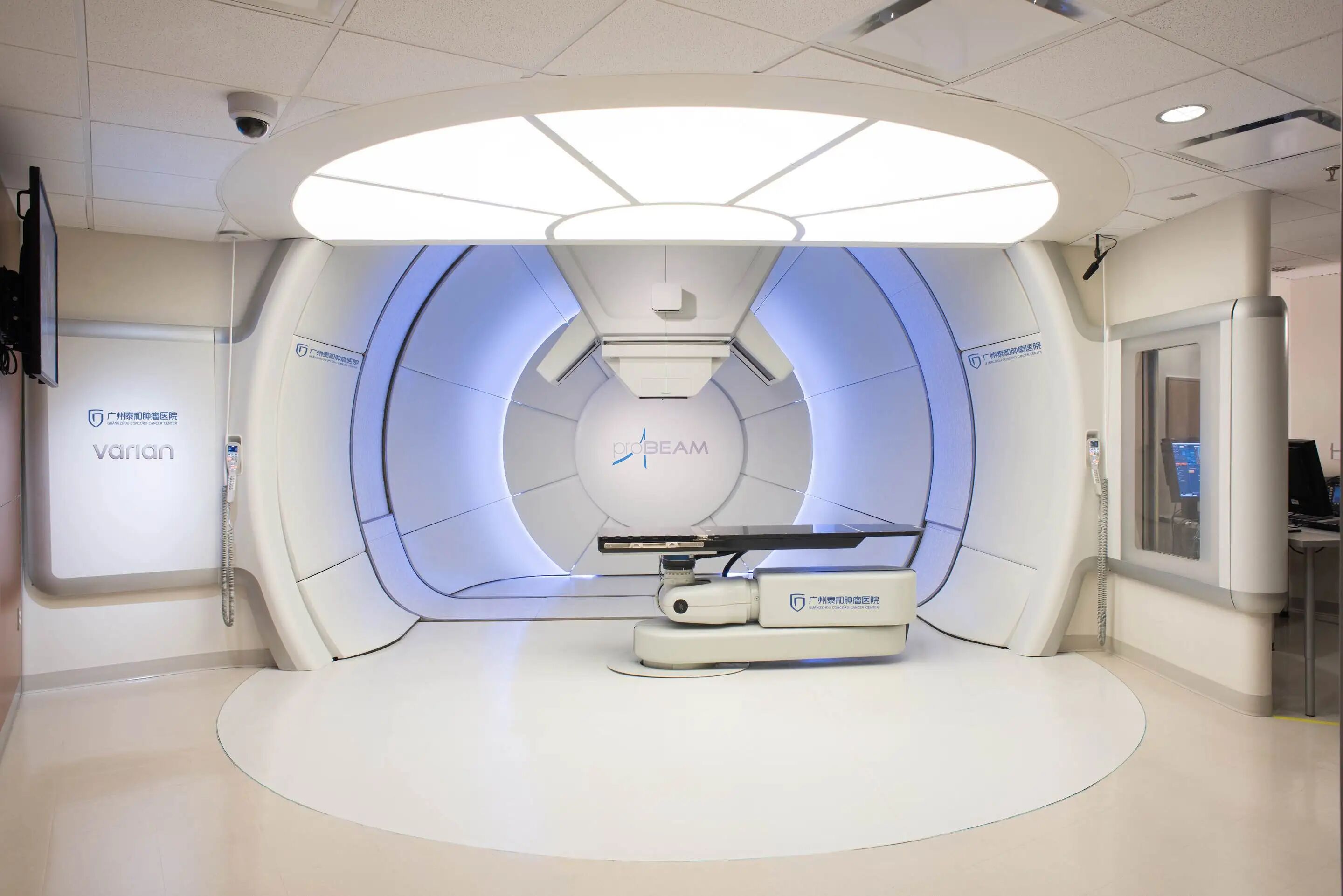 Proton therapy treatment room with clinical team