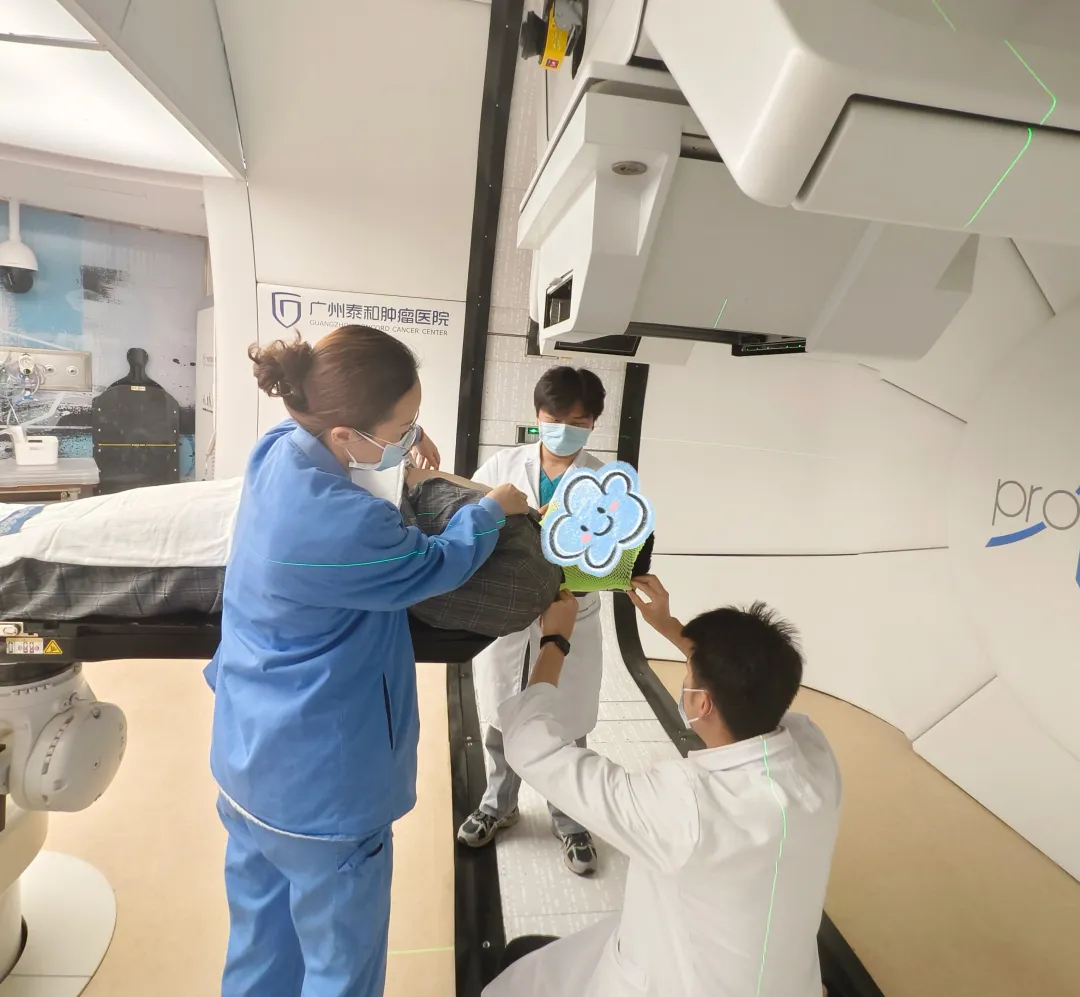 Medical team positioning patient for proton therapy at GCCC